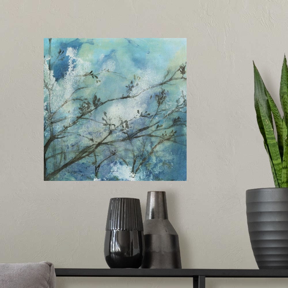 A modern room featuring Contemporary watercolor painting of tree branches against a blue moonlit sky.