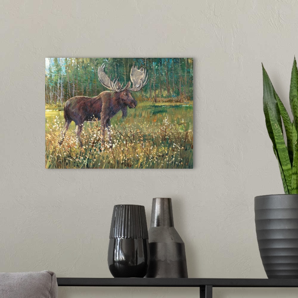 A modern room featuring Contemporary painting of a moose standing in a meadow near a forest.