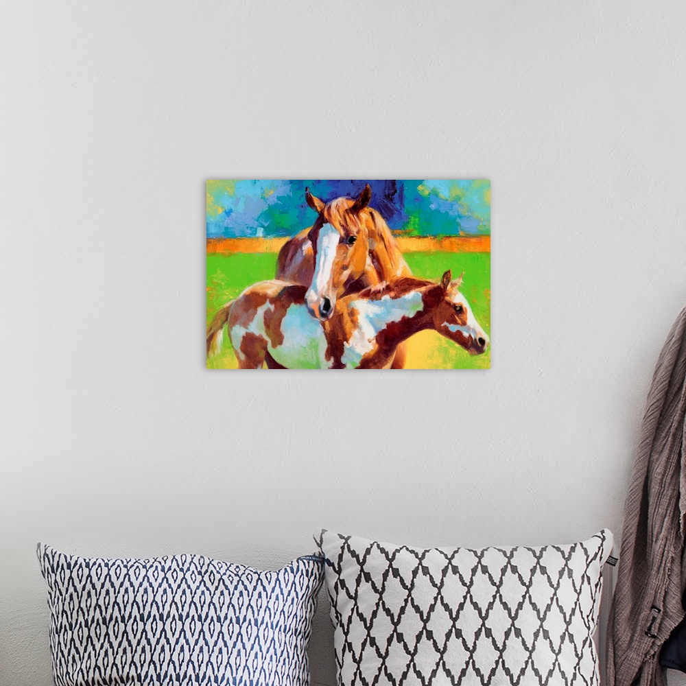A bohemian room featuring Big, horizontal painting of two horse standing in the sunlight, a mother horse leans her head ove...