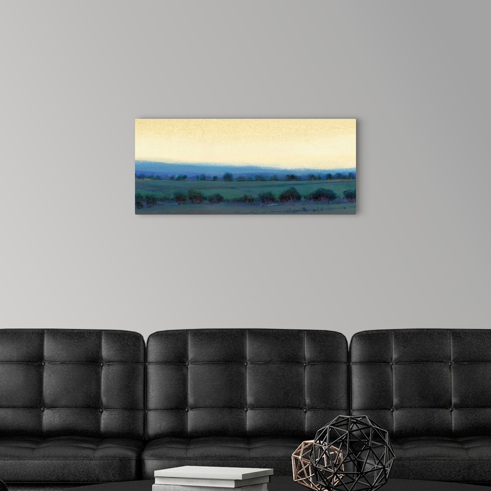 A modern room featuring Contemporary landscape painting of a pasture dotted with trees and a yellow sky overhead.