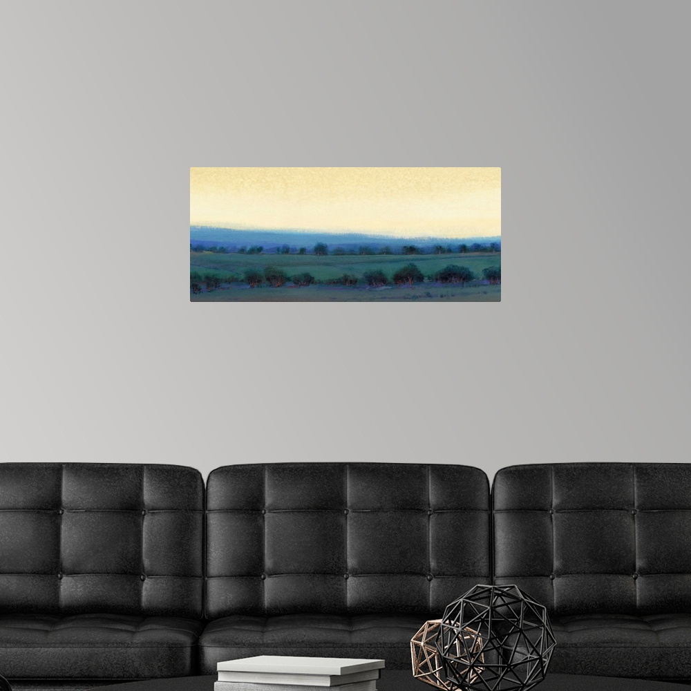 A modern room featuring Contemporary landscape painting of a pasture dotted with trees and a yellow sky overhead.
