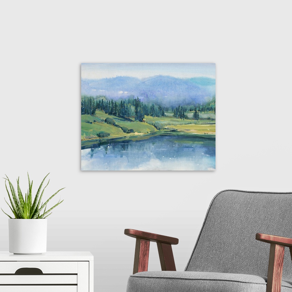 A modern room featuring Large landscape painting with cool tones of a hilly wilderness landscape with a lake in the foreg...