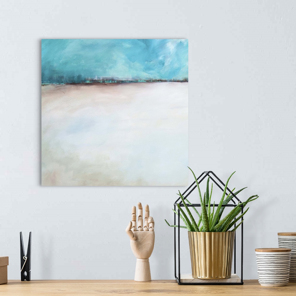 A bohemian room featuring Abstract contemporary artwork resembling a sandy landscape under a blue sky.
