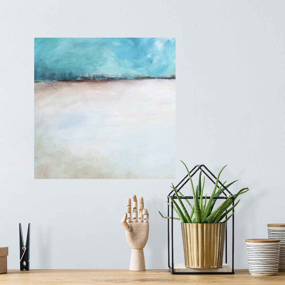A bohemian room featuring Abstract contemporary artwork resembling a sandy landscape under a blue sky.