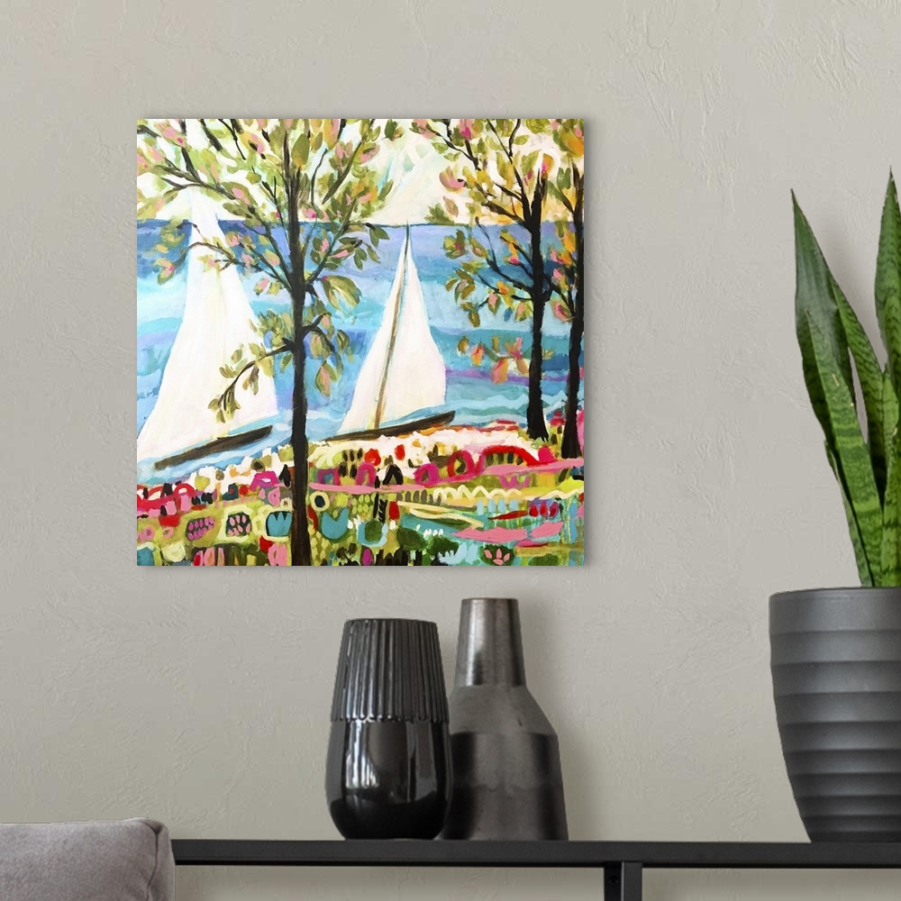 A modern room featuring Contemporary artwork of two sailboats on the ocean, seen through the trees.
