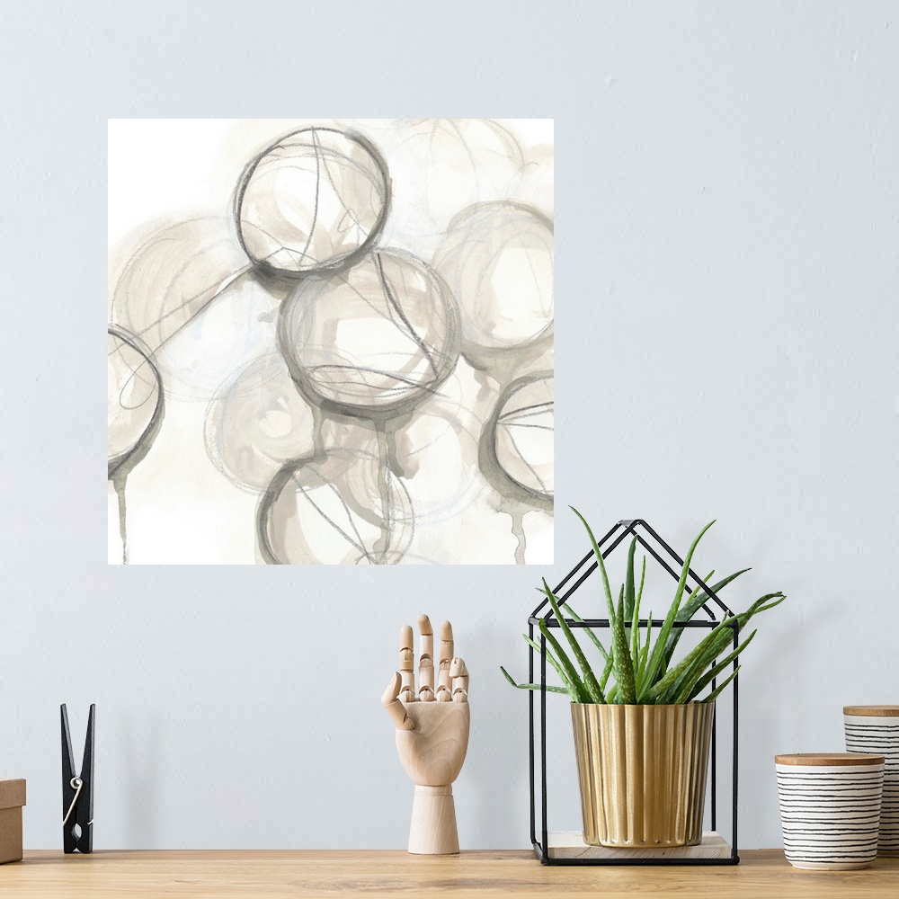 A bohemian room featuring Contemporary watercolor abstract painting consisting of various circular shapes in neutral tones.