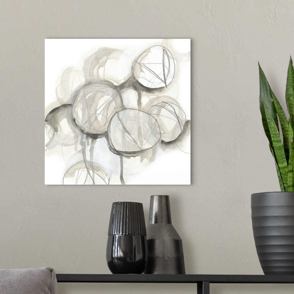A modern room featuring Contemporary watercolor abstract painting consisting of various circular shapes in neutral tones.
