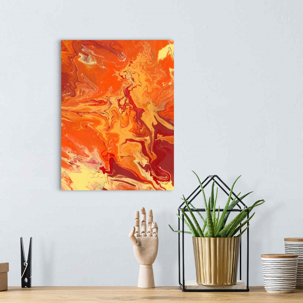 A bohemian room featuring Abstract artwork of yellow, orange and red shades in a liquid marble effect.