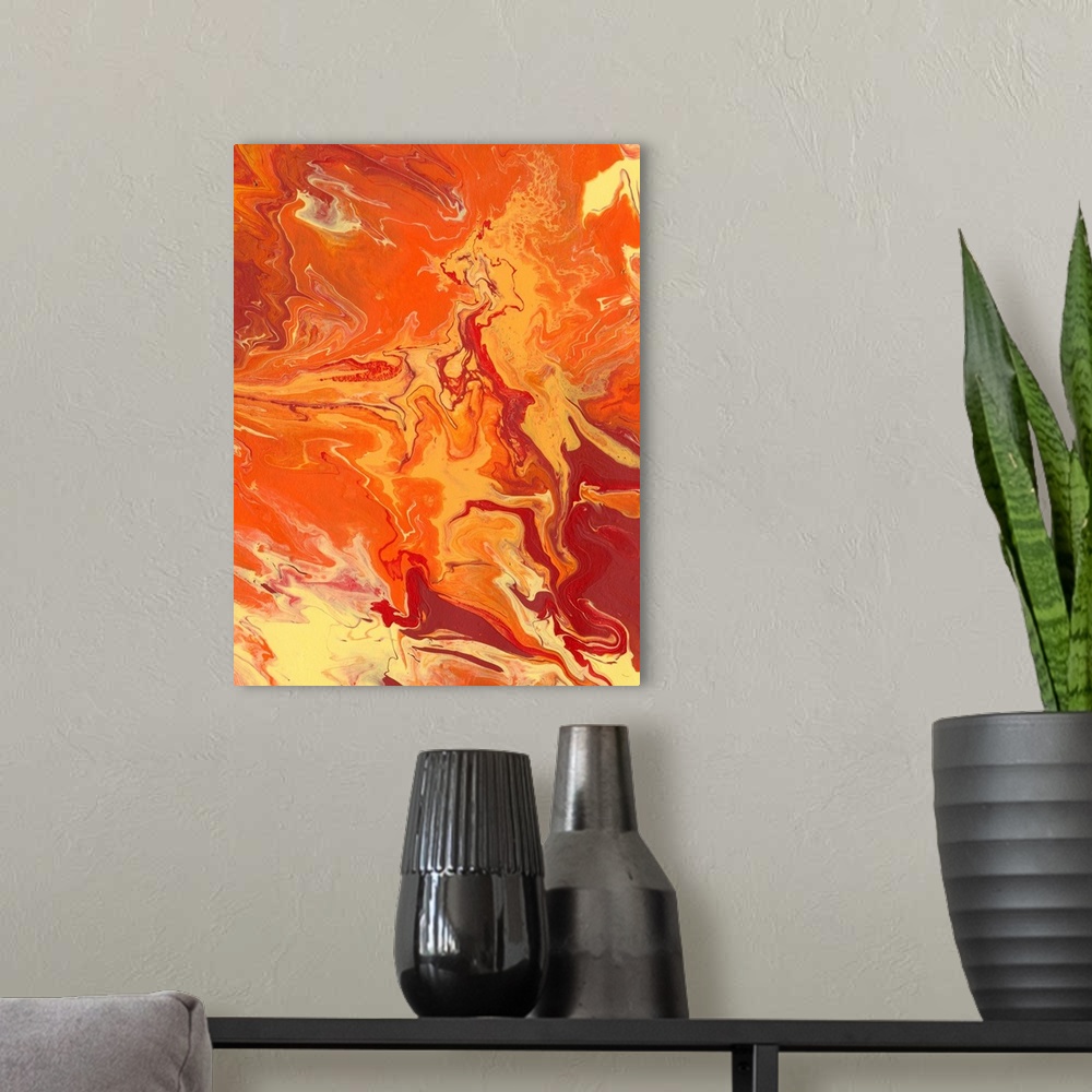A modern room featuring Abstract artwork of yellow, orange and red shades in a liquid marble effect.
