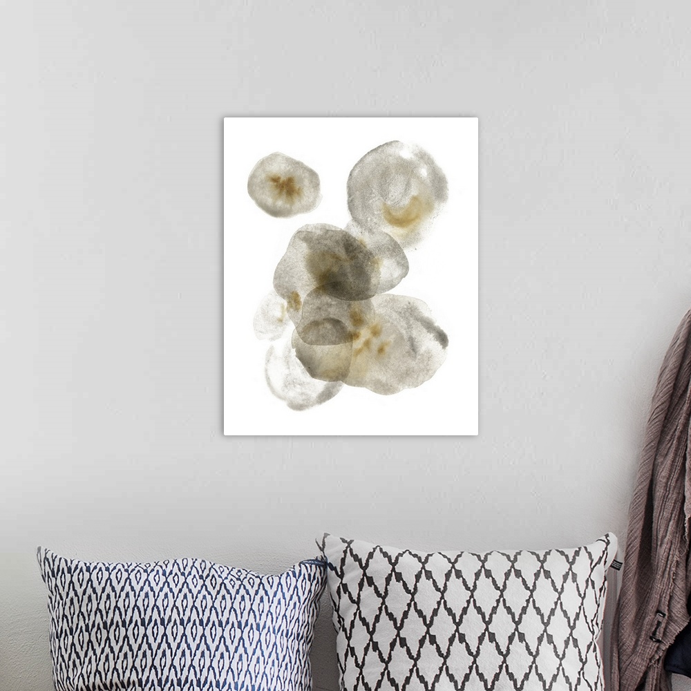 A bohemian room featuring This abstract artwork features puddles of transparent gray color mottled with brown over a white ...