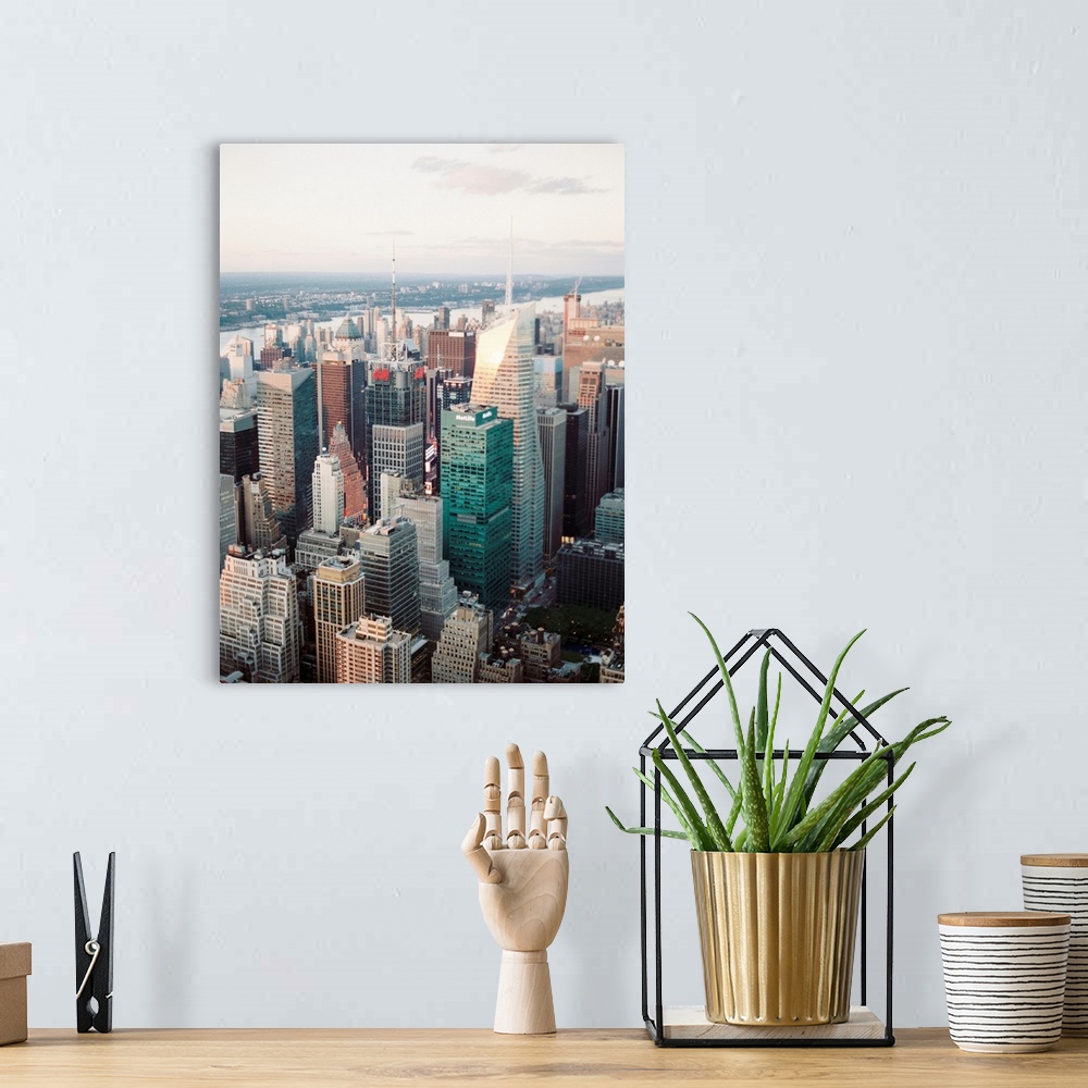 A bohemian room featuring A high angle photograph of the skyscrapers of Manhattan, New York City.