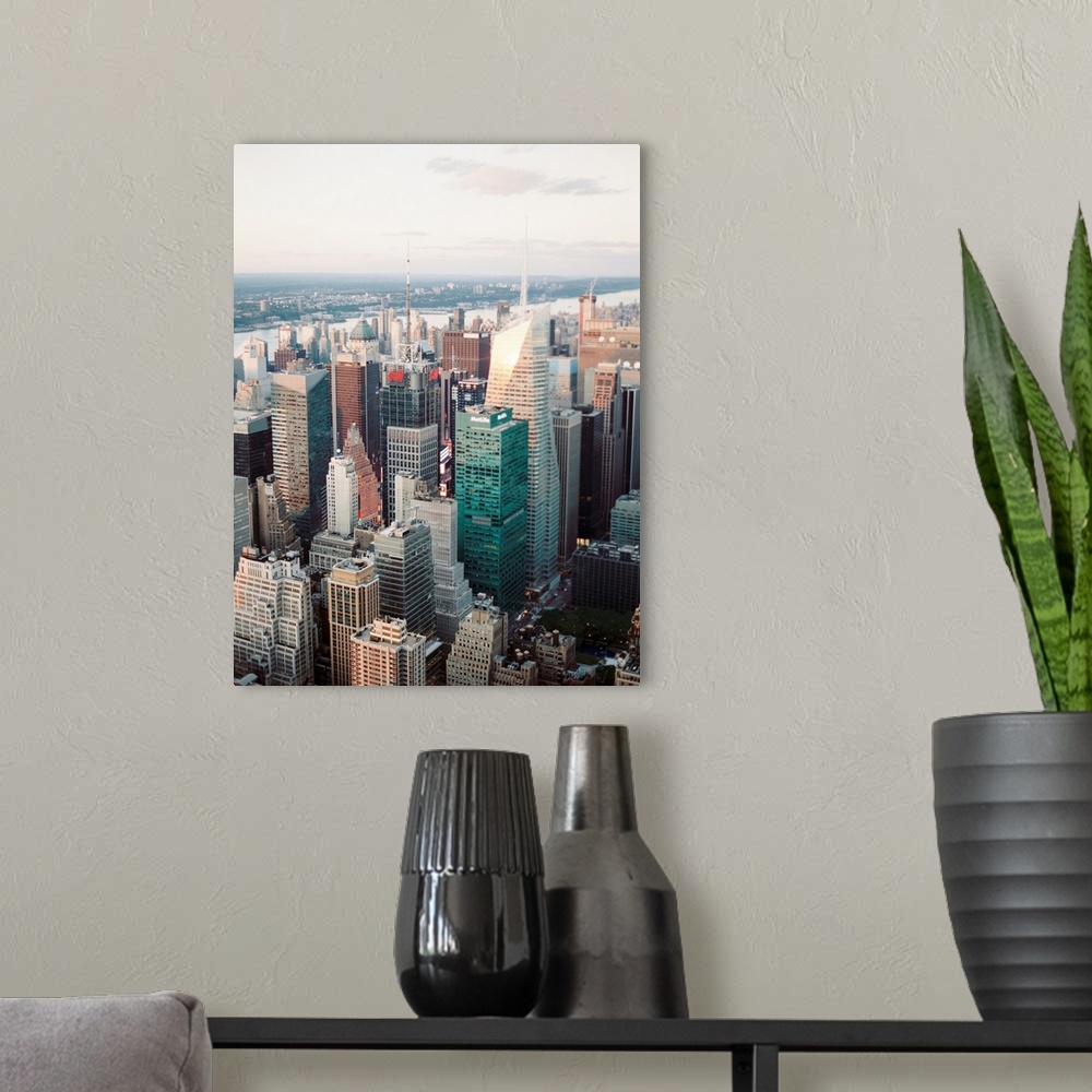A modern room featuring A high angle photograph of the skyscrapers of Manhattan, New York City.