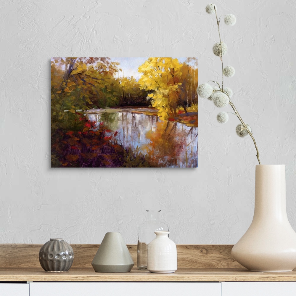 A farmhouse room featuring Contemporary painting of a river through a fall forest landscape.