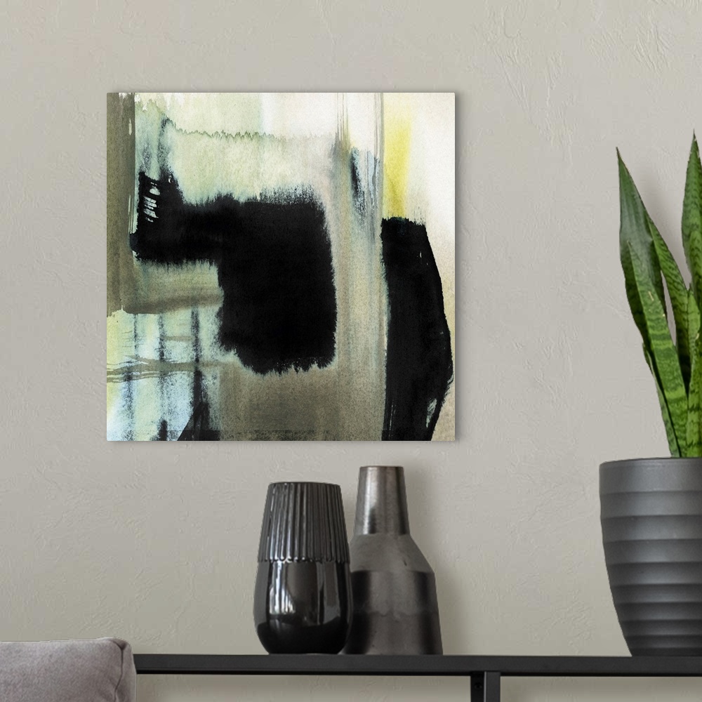 A modern room featuring Abstract contemporary artwork in contrasting shades of black and pale blue and yellow.