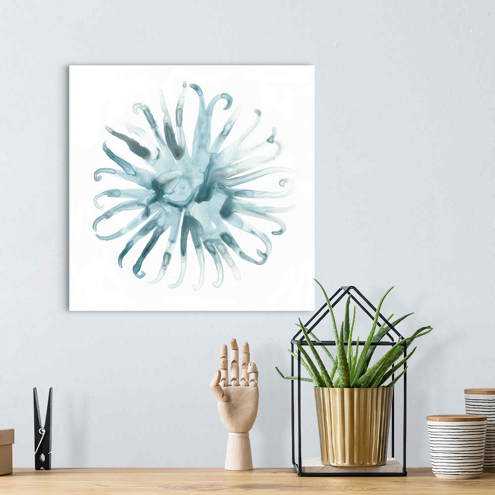 A bohemian room featuring Decorative watercolor painting of sea urchin in shades of blue on a white backdrop.