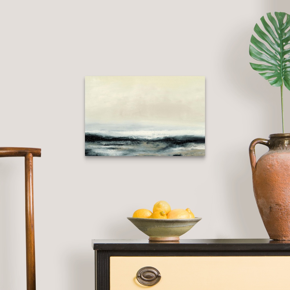 A traditional room featuring Contemporary oceanscape painting of dark seawater under a pale sky.