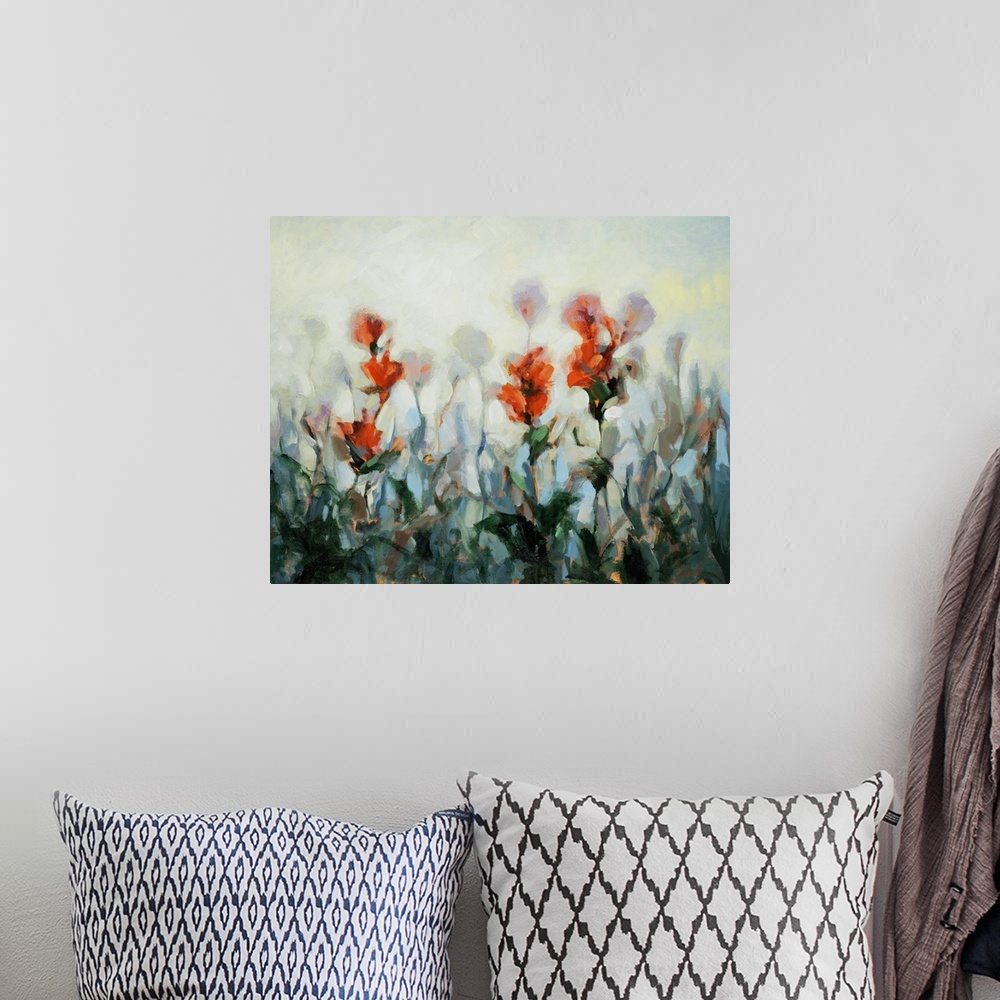 A bohemian room featuring Impressionist style artwork of bright red wildflowers.
