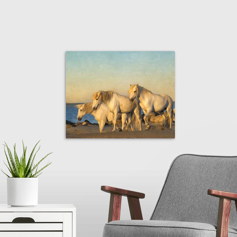 A modern room featuring Photograph of a group of white horses grazing on a beach.