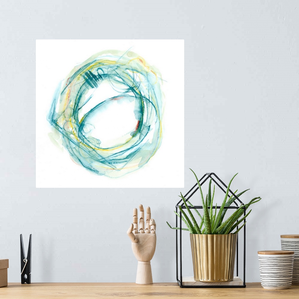 A bohemian room featuring Watercolor abstract artwork of a round shape in aqua and yellow tones.