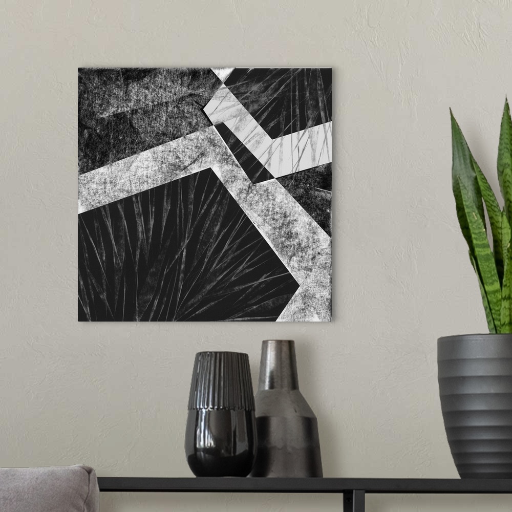 A modern room featuring Black and white geometric abstract painting on a square background.