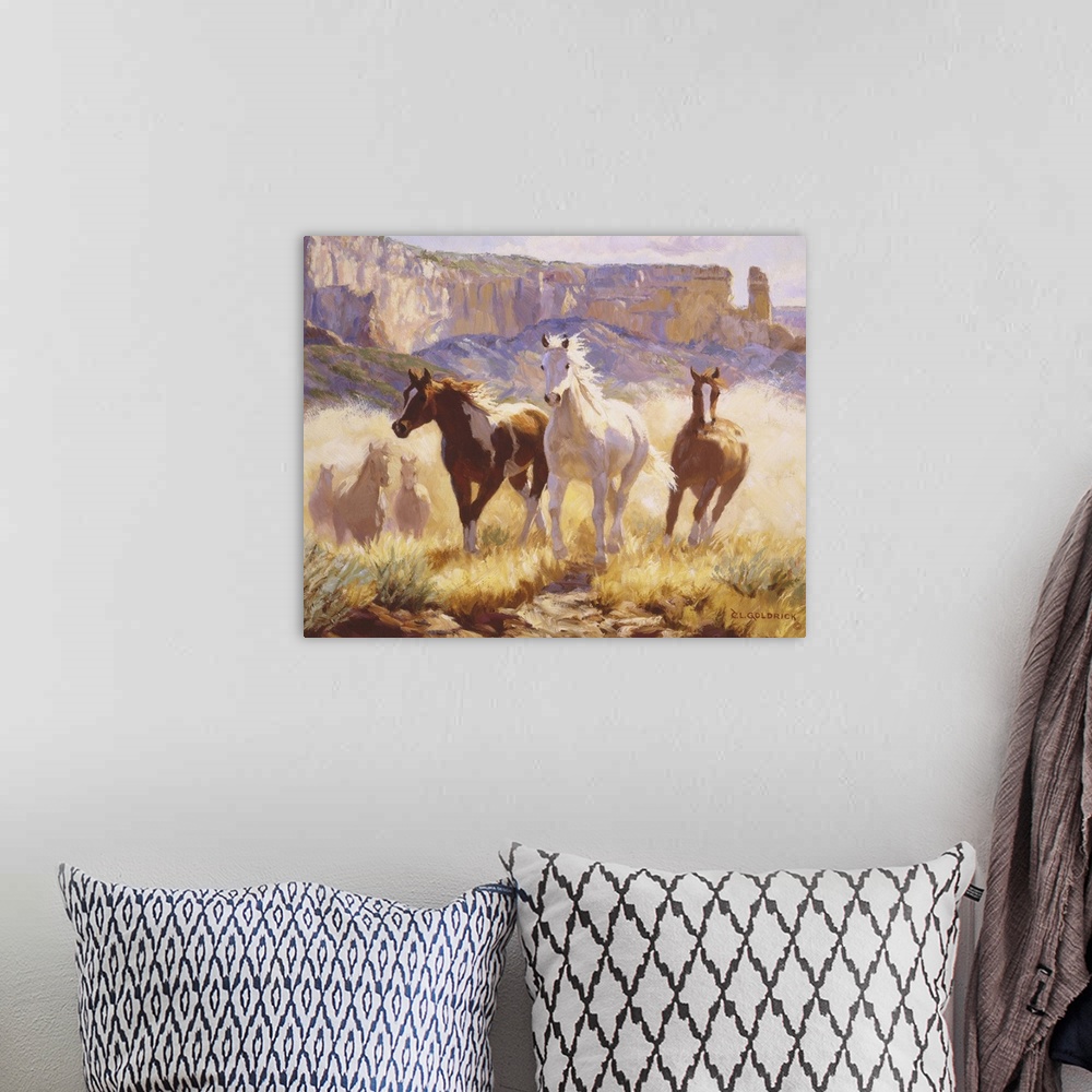 A bohemian room featuring Contemporary colorful painting of a herd of horses running through a desert landscape.