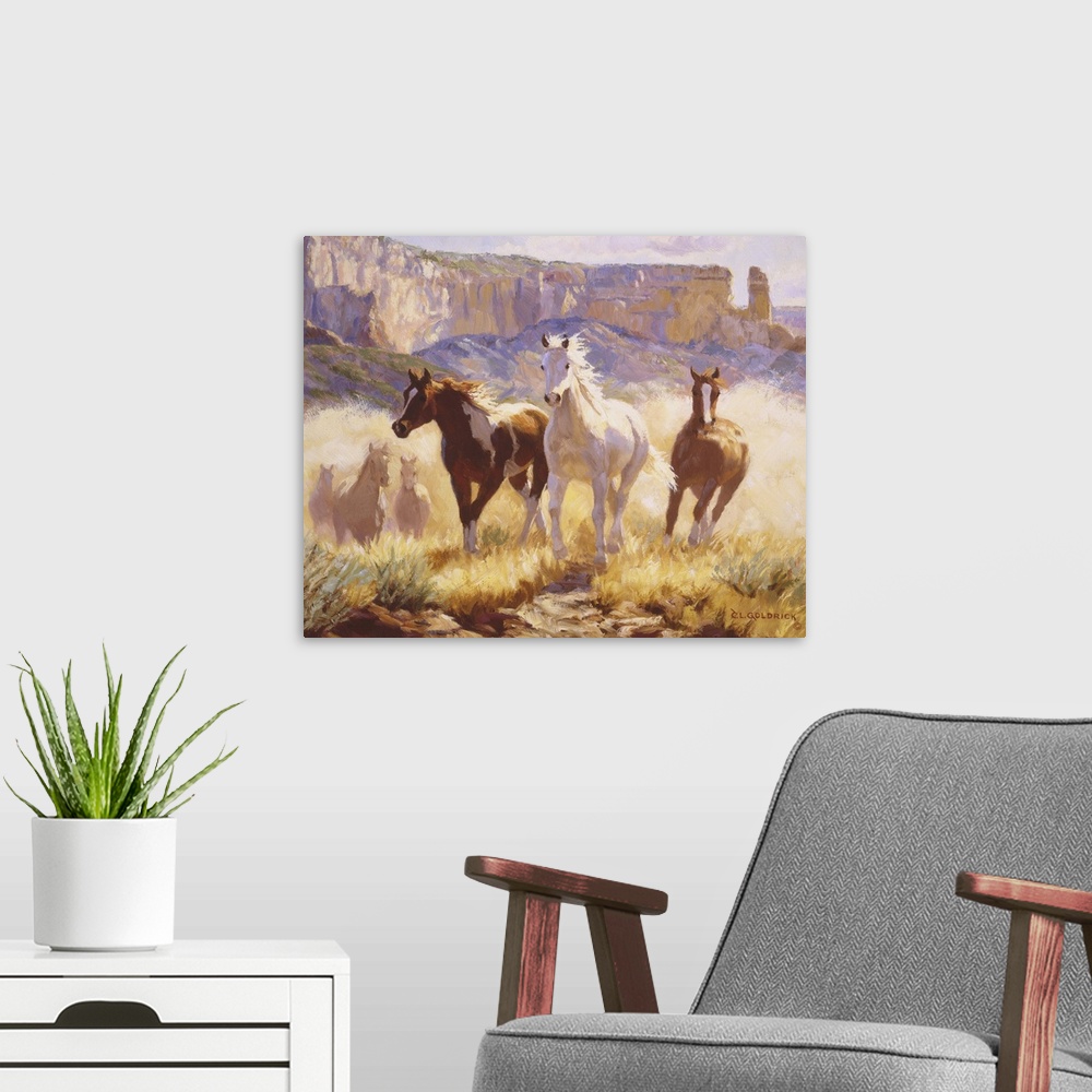 A modern room featuring Contemporary colorful painting of a herd of horses running through a desert landscape.