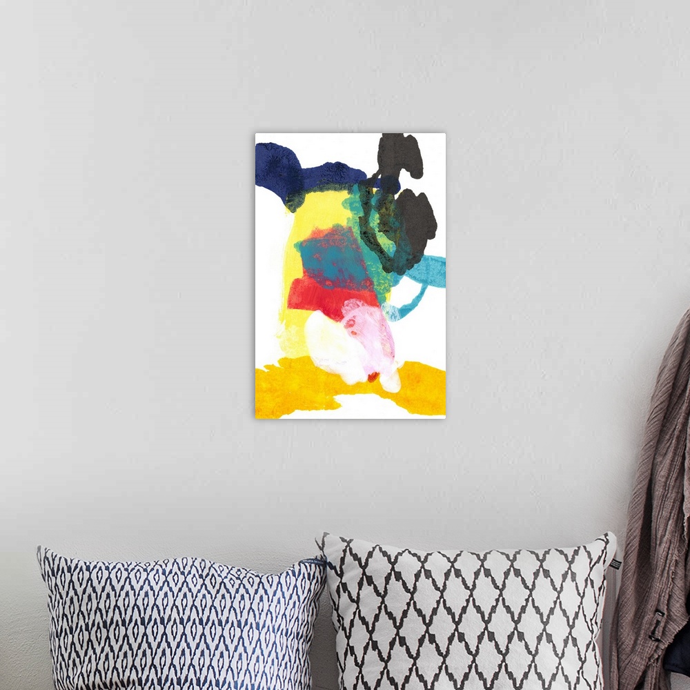 A bohemian room featuring Vibrantly colored abstract artwork in primary colors.