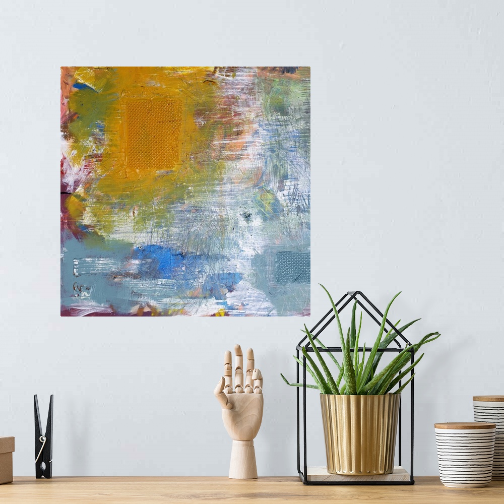 A bohemian room featuring Abstract artwork of a multitude of vibrant and pale colors colliding with one another.