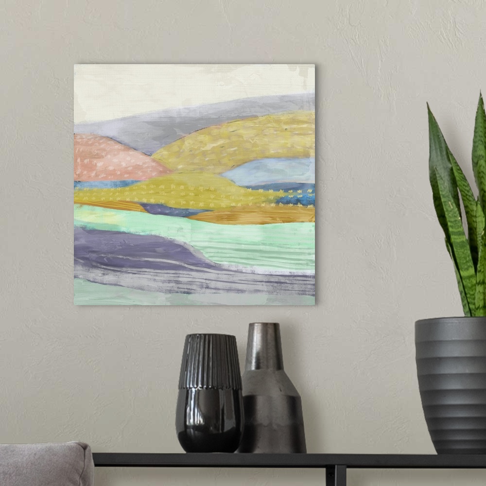 A modern room featuring Abstract painting of a multi-colored hilly landscape.