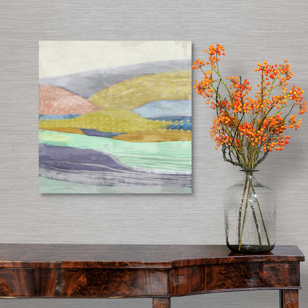 A traditional room featuring Abstract painting of a multi-colored hilly landscape.