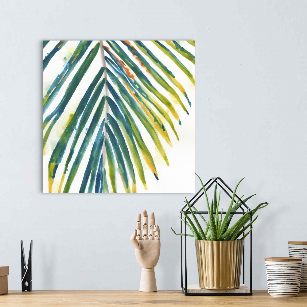 A bohemian room featuring Watercolor painting of a palm frond with teal and yellow leaves.