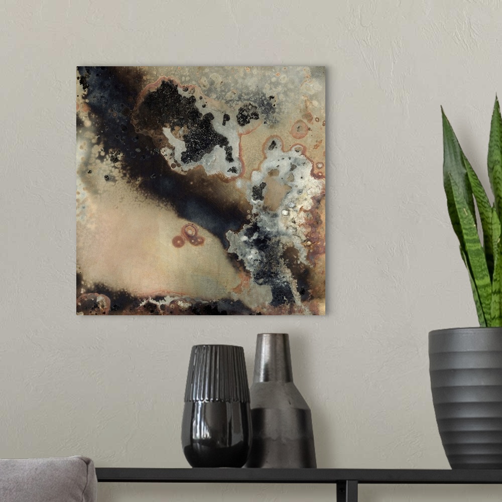 A modern room featuring Contemporary abstract painting using dark smokey colors and rough geological looking textures.