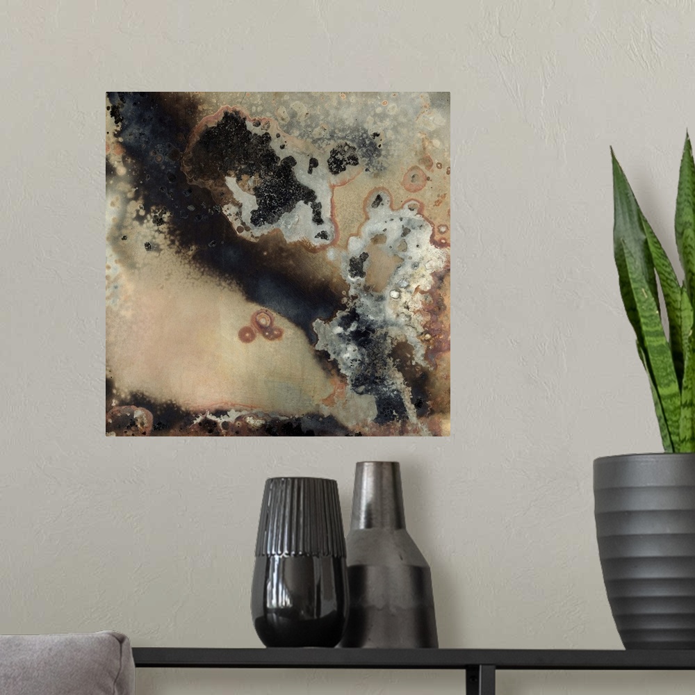 A modern room featuring Contemporary abstract painting using dark smokey colors and rough geological looking textures.