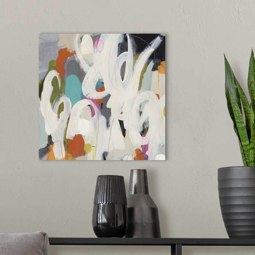 A modern room featuring Contemporary abstract painting of loopy paint strokes against a background colorful daubs of paint.