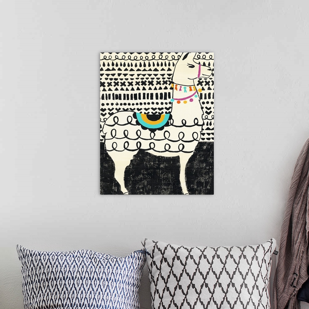 A bohemian room featuring Whimsical painting of a llama in black and white wearing colorful party decorations.
