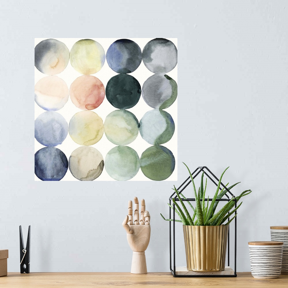 A bohemian room featuring Watercolor painting of colorful circles in rows on a white, square background.