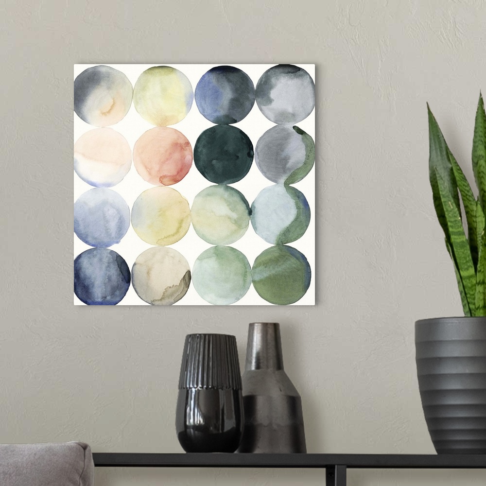 A modern room featuring Watercolor painting of colorful circles in rows on a white, square background.