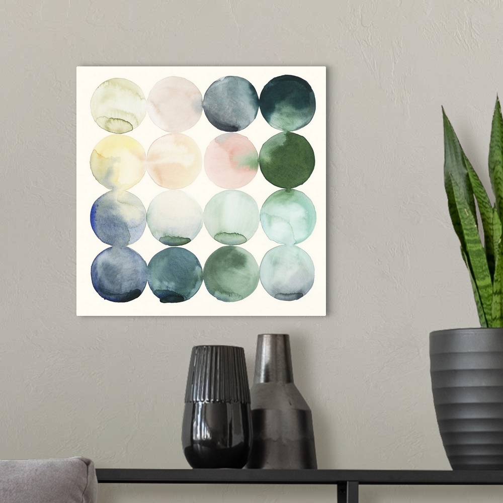 A modern room featuring Watercolor painting of colorful circles in rows on a white, square background.