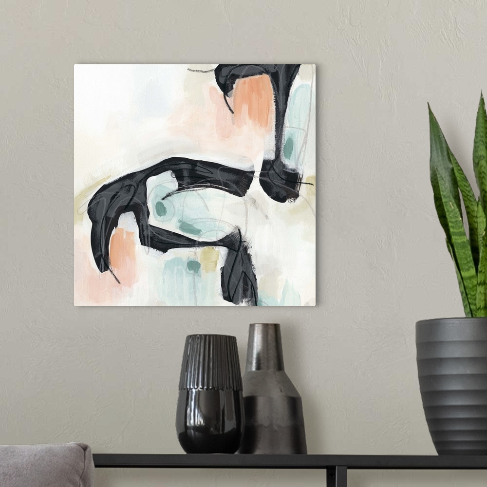 A modern room featuring Abstract artwork of black organic shapes contrasted with pastel shades of orange and blue.