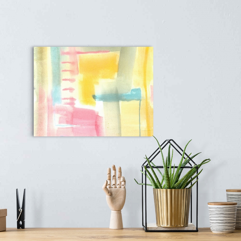 A bohemian room featuring Pastel abstract watercolor artwork in blended shapes of pink, grey, teal, and yellow.