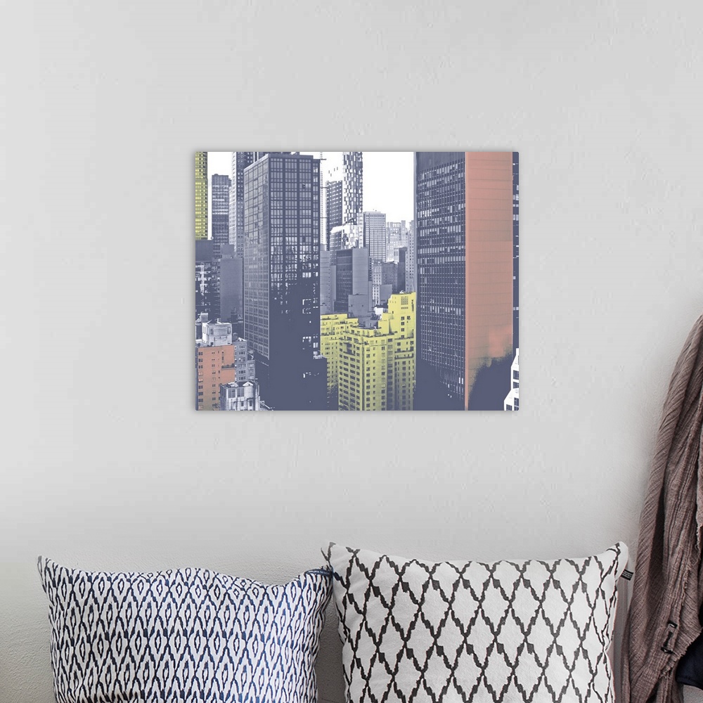 A bohemian room featuring Photograph of a cityscape that some buildings have been edited to a color effect.