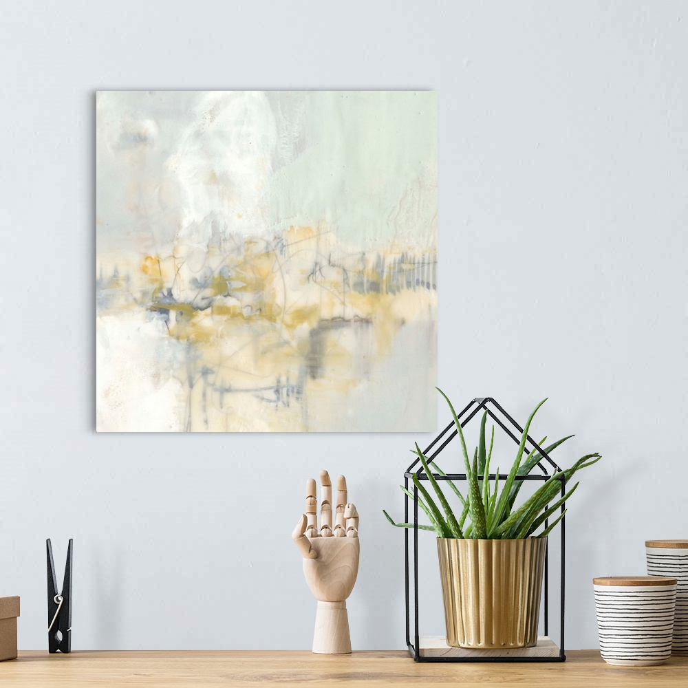 A bohemian room featuring Pale colored abstract artwork in shades of yellow and mint green.