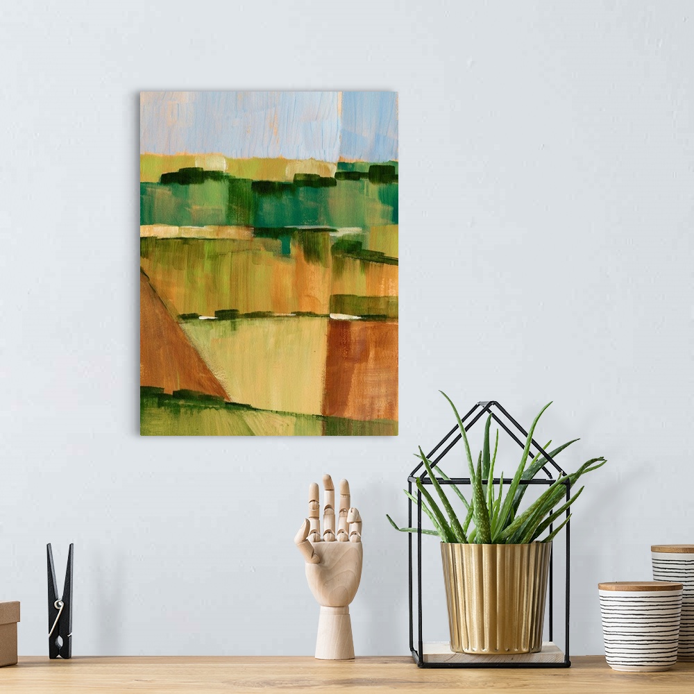 A bohemian room featuring Contemporary semi-abstract painting of farmland under a dusty blue sky.