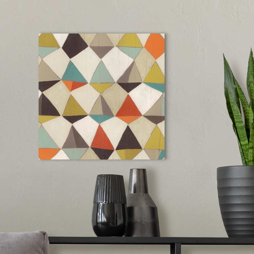 A modern room featuring Contemporary home decor art of a geometric pattern using muted colors.