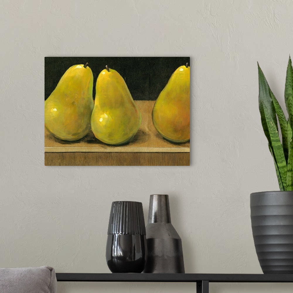 A modern room featuring Horizontal painting on a big canvas of three shining pears sitting on a flat surface, on a dark b...