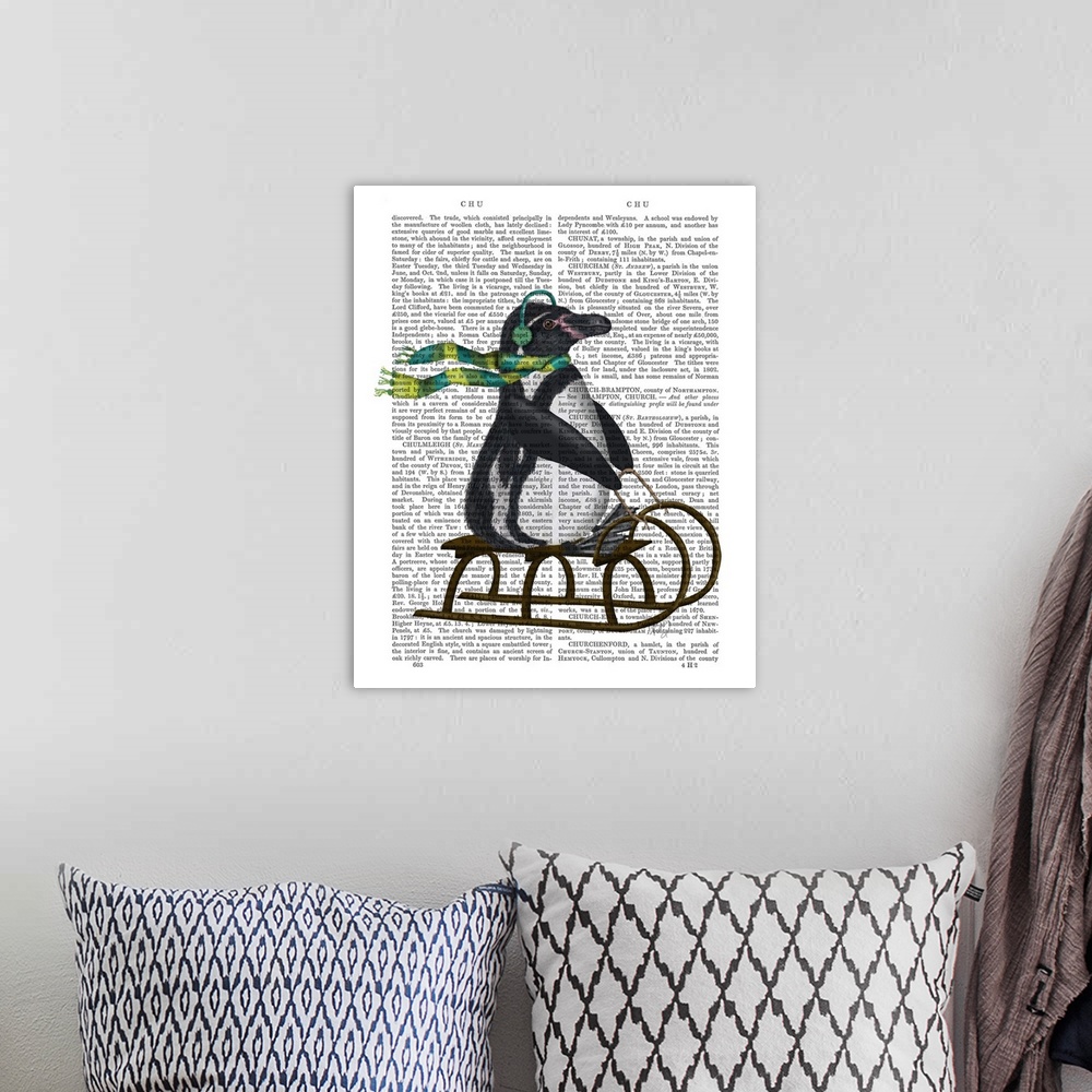 A bohemian room featuring Decorative art with a penguin riding a sled painted on the page of a book.