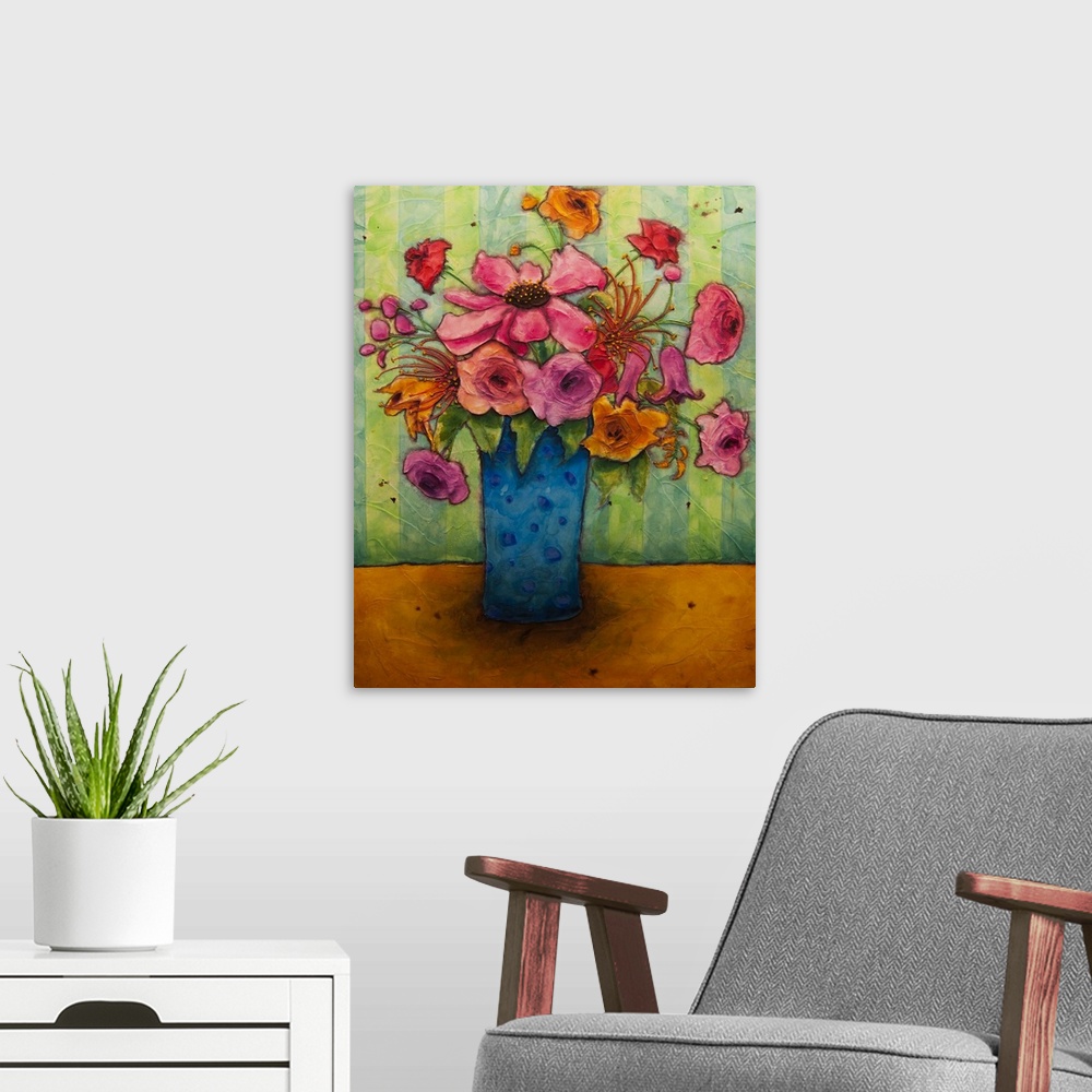 A modern room featuring A painting of a blue vase holding a bouquet of pink flowers.
