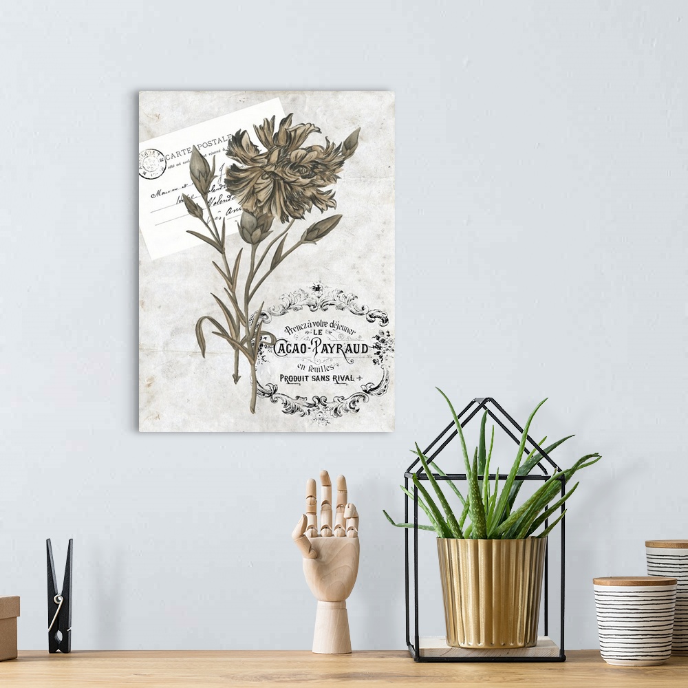 A bohemian room featuring Decorative artwork of a gold flowers on french stamps and emblems in neutral tones.