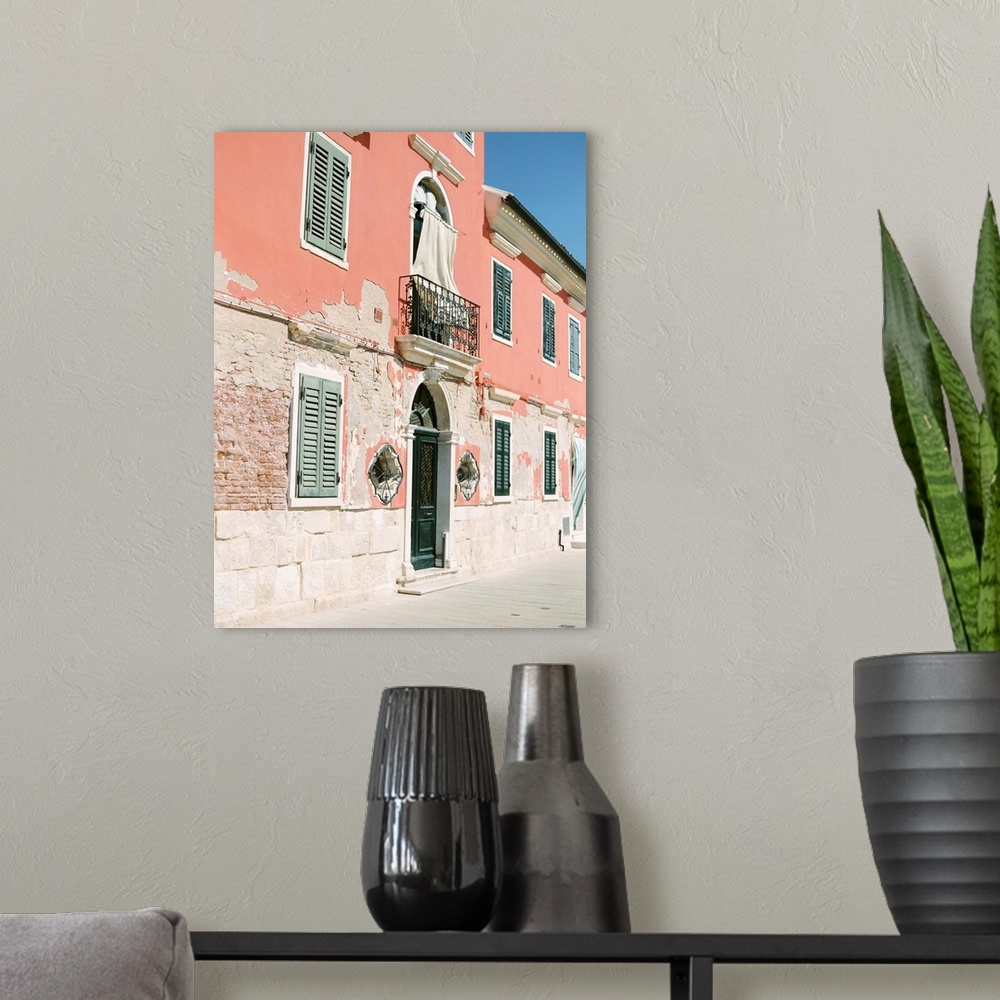 A modern room featuring Photograph of ornate doors and windows in old buildings, Burano, Italy.