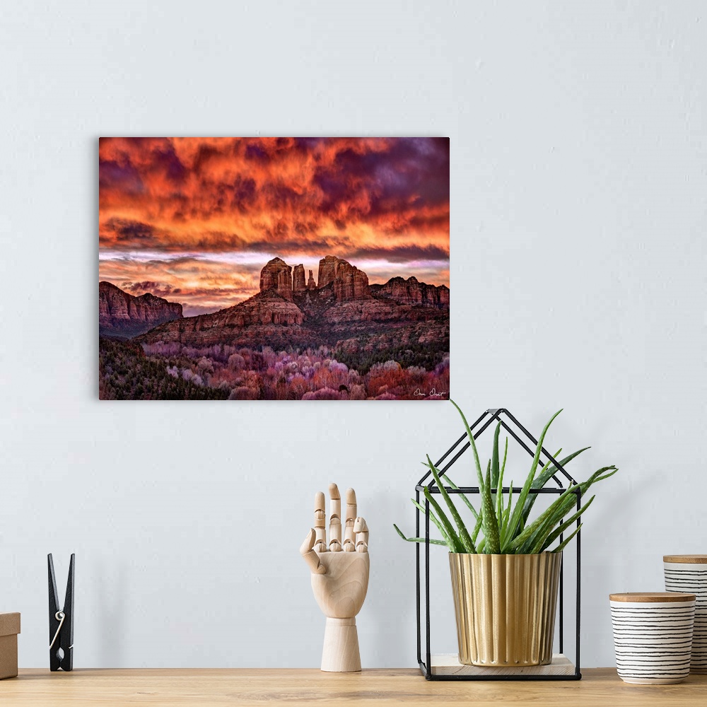 A bohemian room featuring High definition photograph of sandstone canyons with a fire sky above.